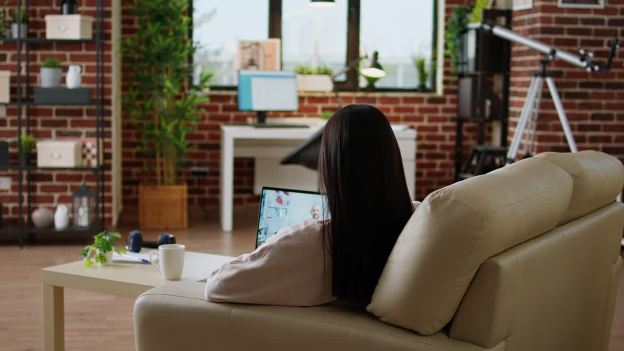 Woman on Video Call with Doctor at Home
