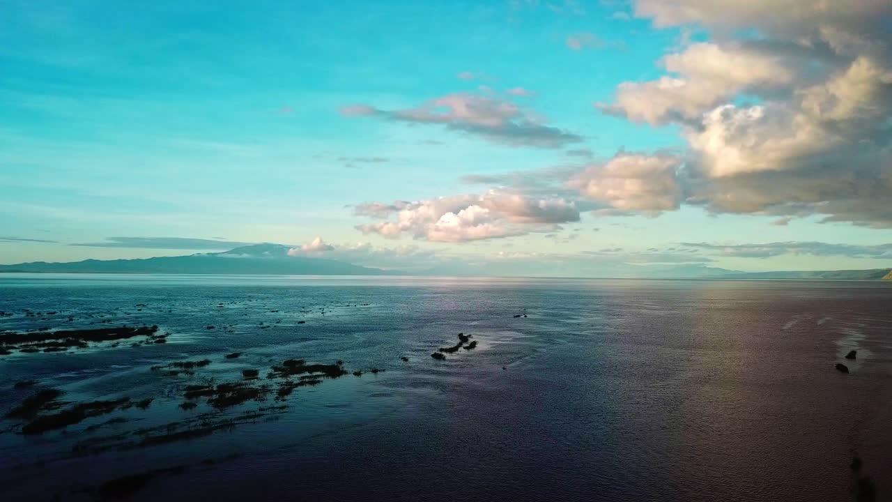 Lake Natron Against Blue Cloudy Sky In Tanzania - aerial drone shot