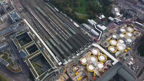 aerial of huge railroads and construction site of main train station stuttgart s21 with cranes and construction worker in stuttgart, germany