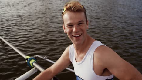 male rower laughing and smiling at the camera