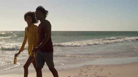 couple walking together on the beach 4k