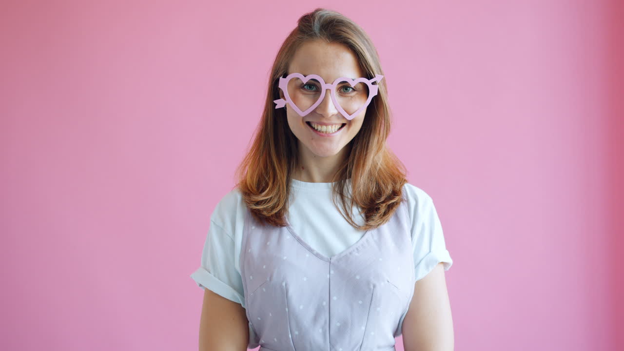 Woman wearing heart-shaped glasses