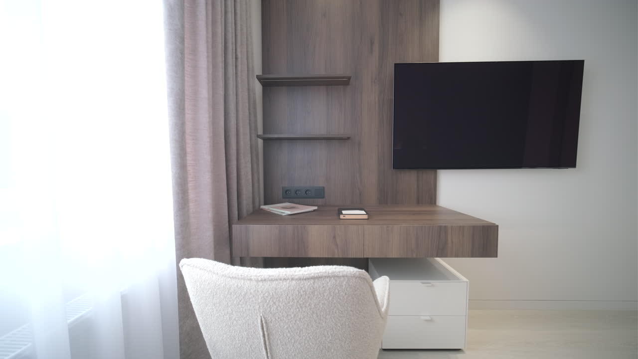 Modern Home Office Workspace with Desk and Wall-Mounted Television