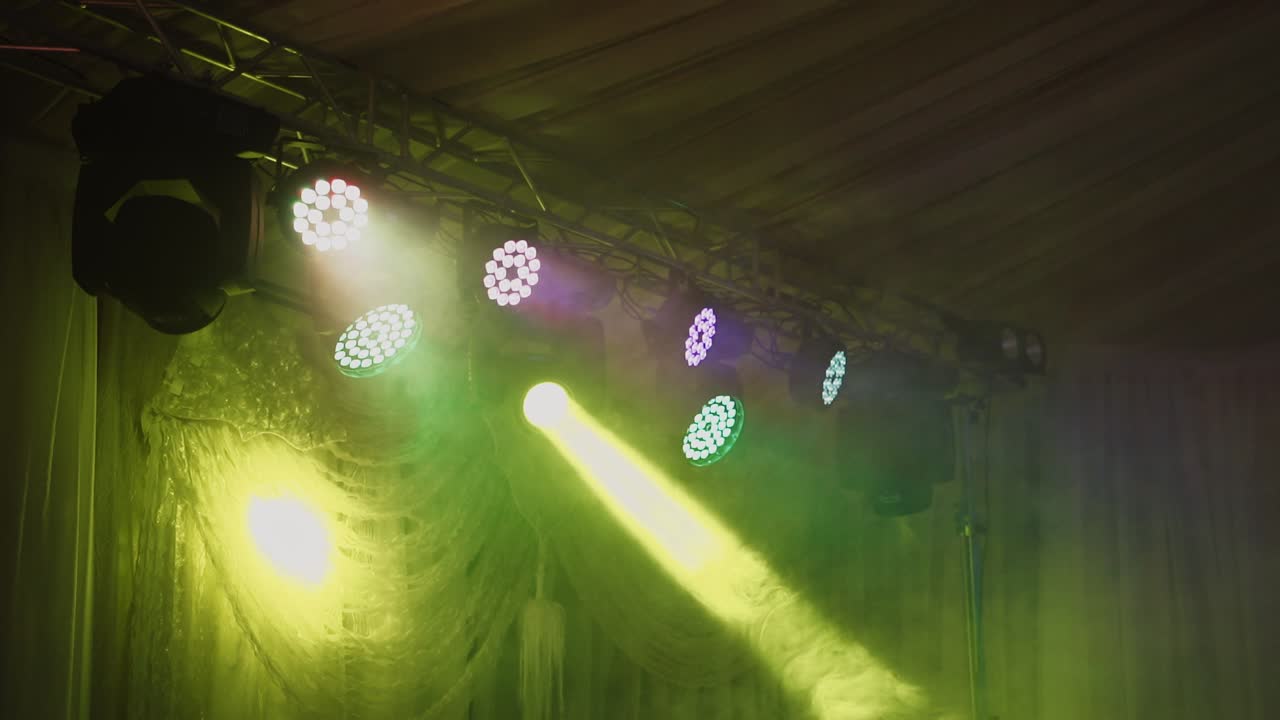 Disco light show. Stage color lights with laser. Lighting system for the dance floor in the nightclub.
