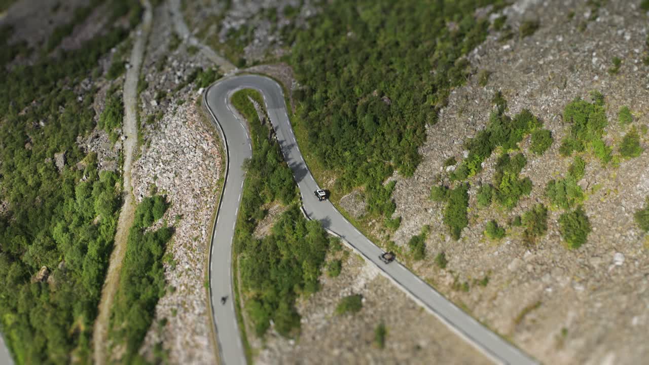 Aerial View of Cars Driving on a Winding Mountain Road
