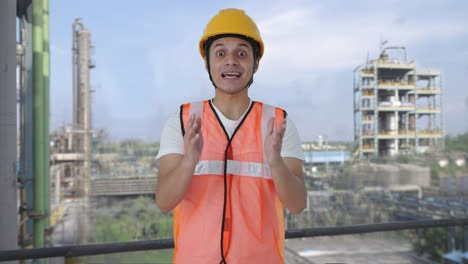happy indian construction labour talking to someone