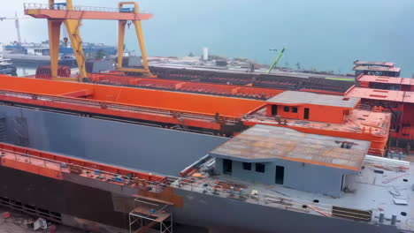 shipyard steel frame basic industrial factory ship repair facility industry. sprawling docks, towering cranes, maritime construction. reveals industrial vessel assembly, heavy machinery