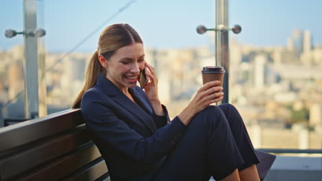 joyful businesswoman laughing smartphone conversation. happy office manager rest