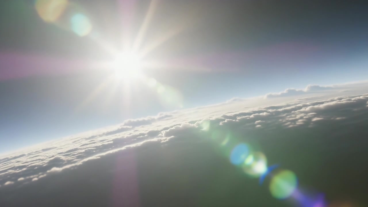Drifting platform causing rotating camera, capturing sun and lens flare moving downward over clouds