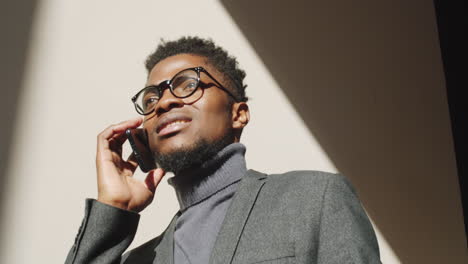 Young-Black-Businessman-Having-Phone-Talk