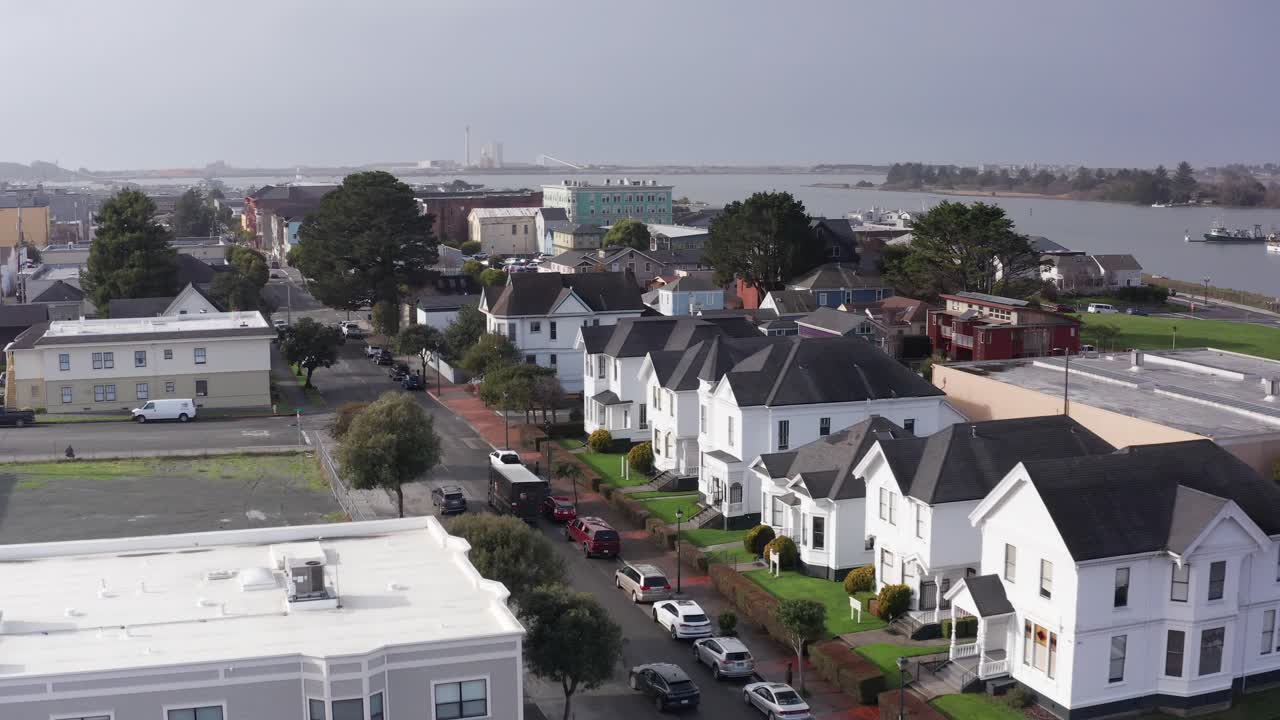 Aerial low dolly shot over historic buildings in old town Eureka, California. 4K