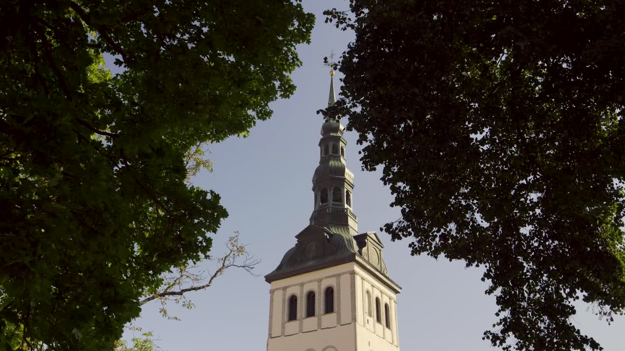 St Olaf Church cinematic view between vibrant green trees