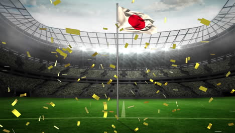 animation of golden confetti falling over waving japan flag against sport stadium