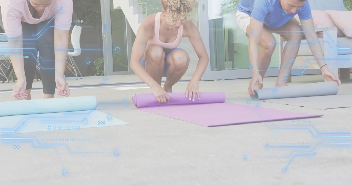 On digital prompt appearing yoga trio squatting and unrolling mats to workout with circuit graphics