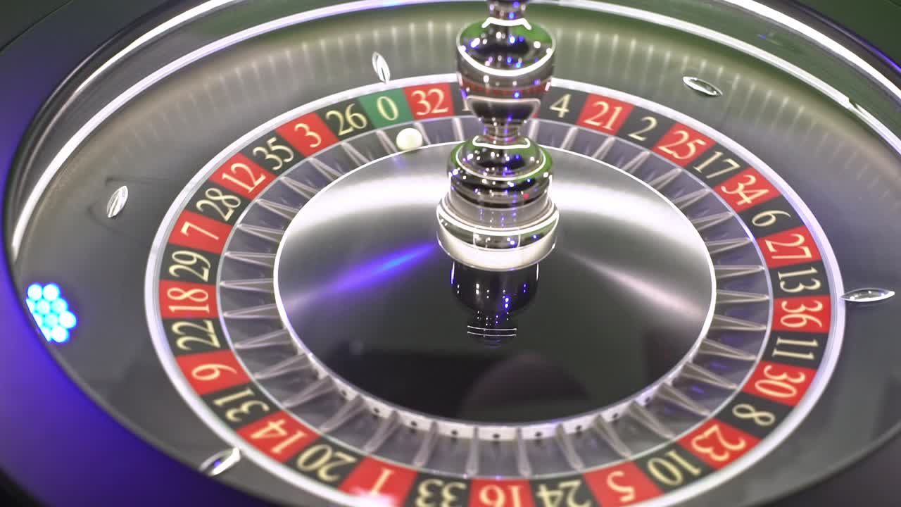Close-up of a roulette wheel spinning with the ball landing on a number, against a green screen background