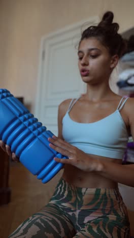 woman using a foam roller for self-massage