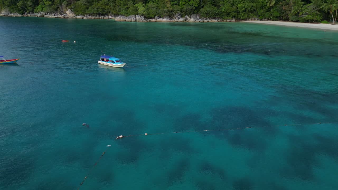 Aerial View of Tropical Island Beach with Kayakers and Boats