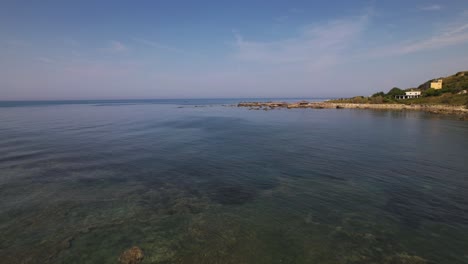 shallow water of sea lagoon near rocky coastline of adriatic sea in durres, albania