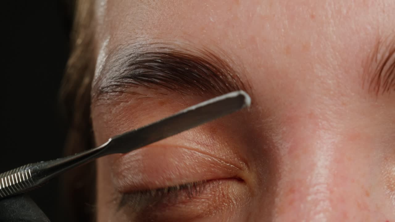 Halloween concept. Demon devil woman with red face and small horns on black background Ideas for halloween body art, make up artist.