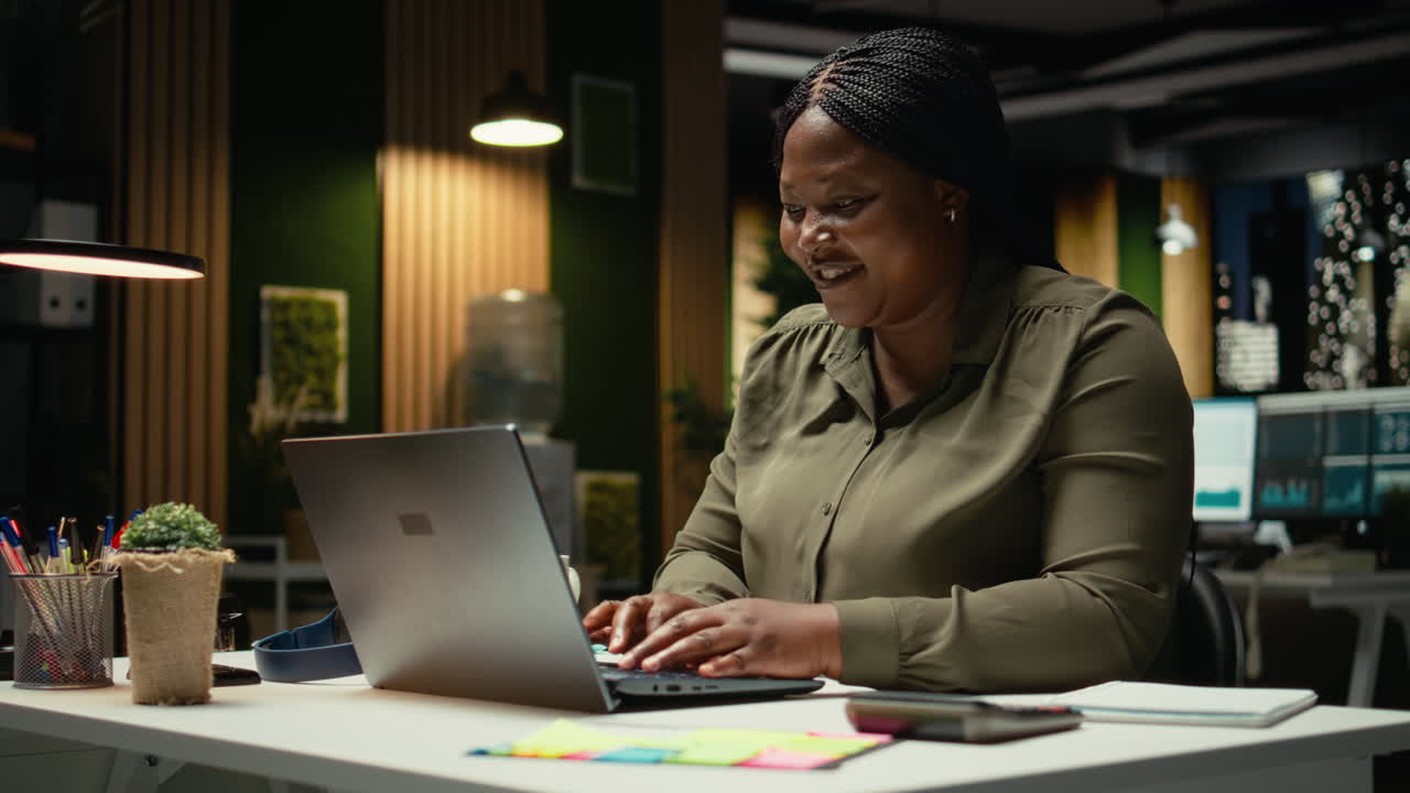 Black clever businesswoman getting a new idea and making a discovery at night