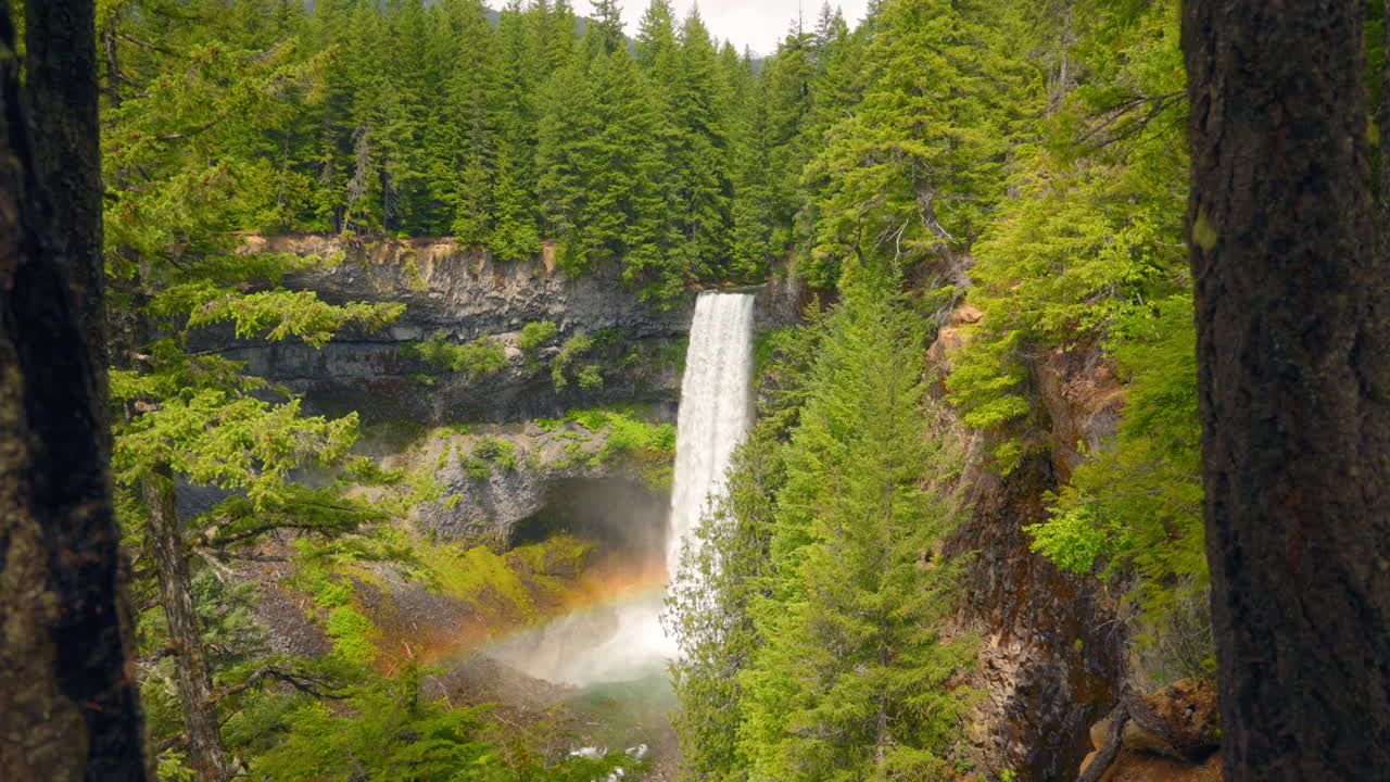 Captivating Waterfall with Rainbow at Squamish - Nature's Tranquil Beauty in Motion
