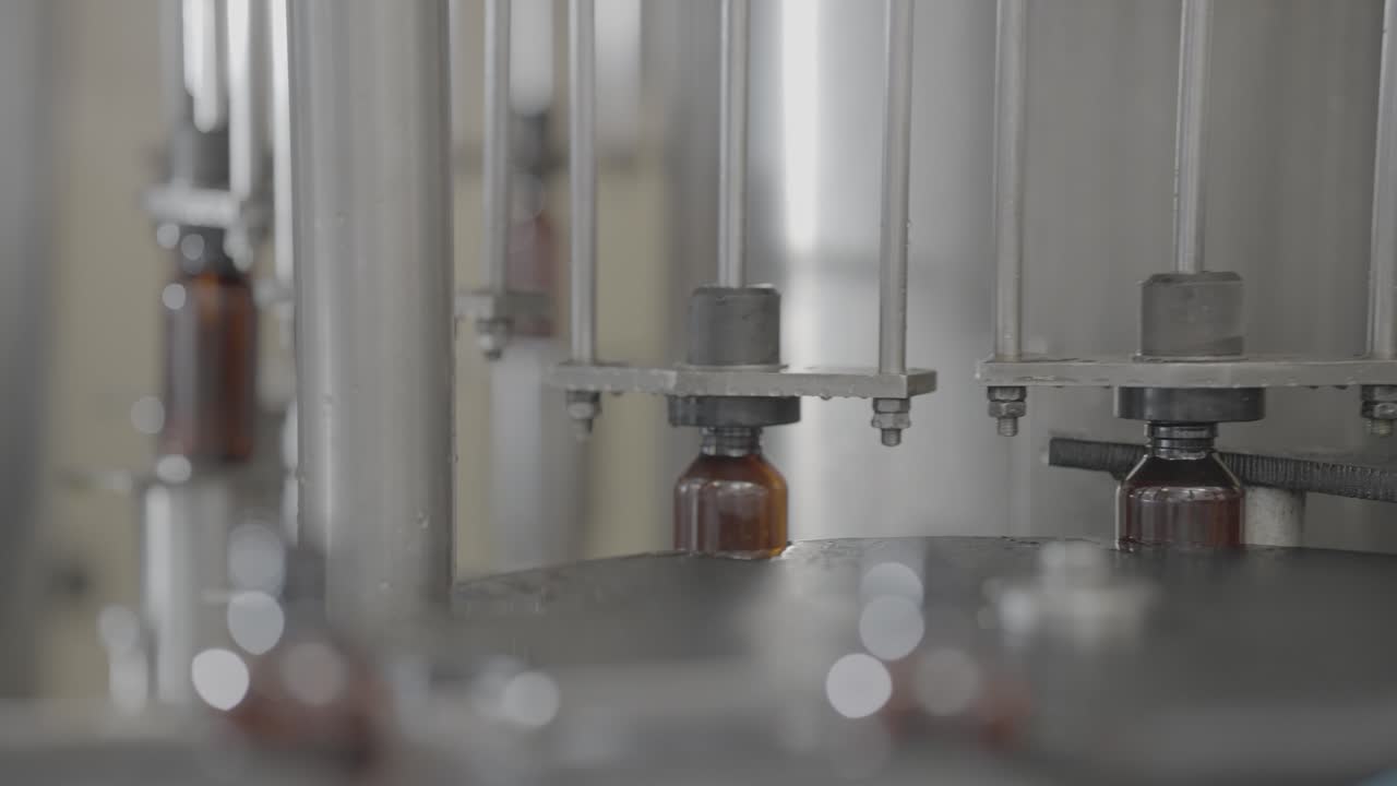Syrup Bottles getting filled with liquid medicine Slog footage ...