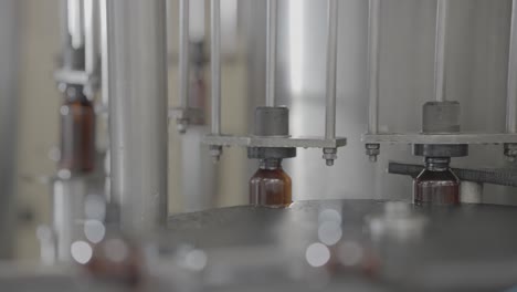 syrup bottles getting filled with liquid medicine slog footage.