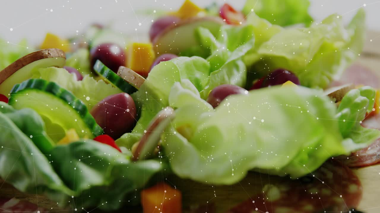 HUD overlays appearing and scanning plated salad, multiplying, updating readouts to show nutrition