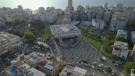 Parallax-shot-of-The-old-city-hall-of-Bat-Yam,-Israel---The-building-is-in-the-shape-of-an-inverted-ziggurat-built-from-concrete,-built-between-1960-1963,-the-building-stood-alone-close-coastline