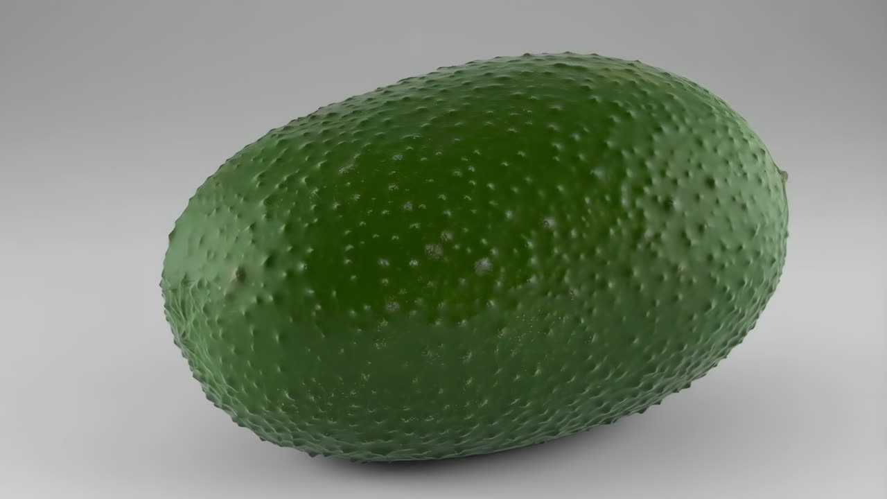 Green Avocado on a Plain Background