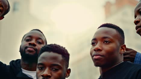 group of young black men standing together and looking up