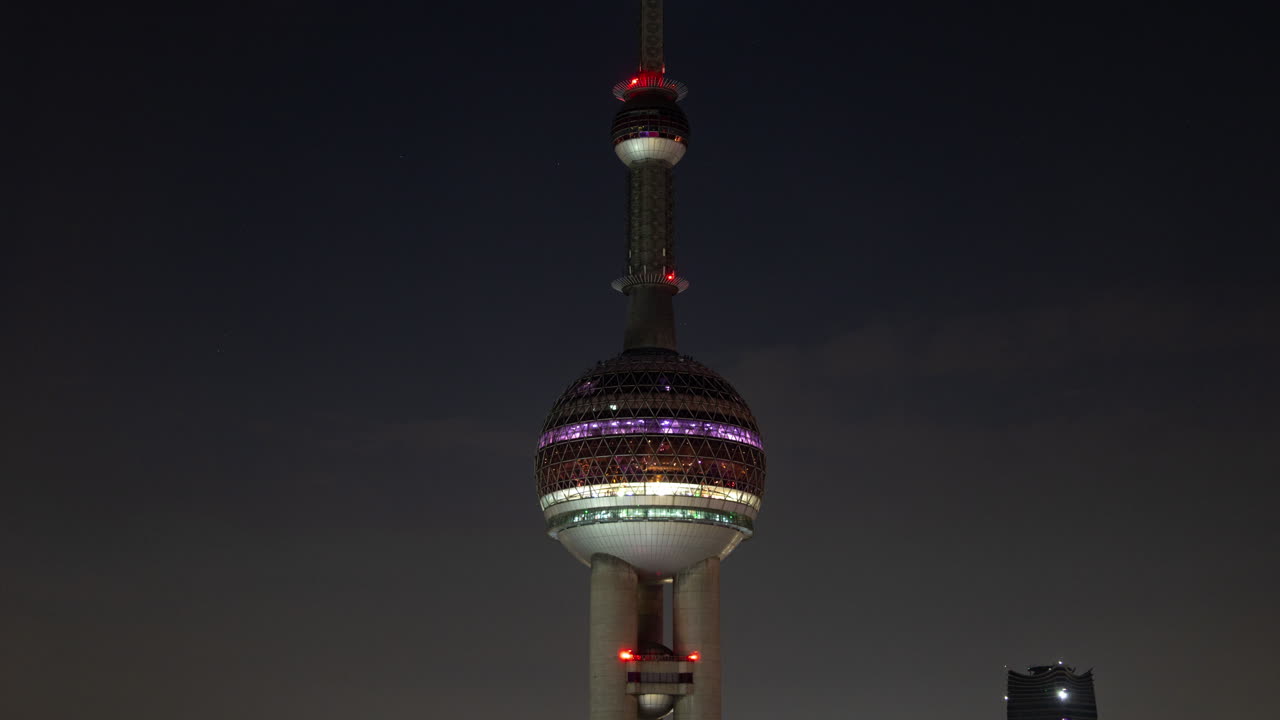 Timelapse of the Shanghai city skyline with traffic passing at nigh