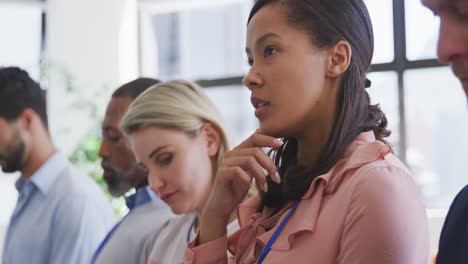 Business-people-attending-to-a-meeting-in-conference-room