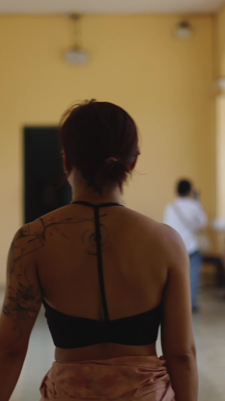 Woman with tattoos on her back