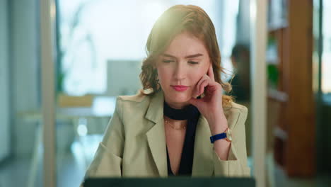 businesswoman working on laptop in office