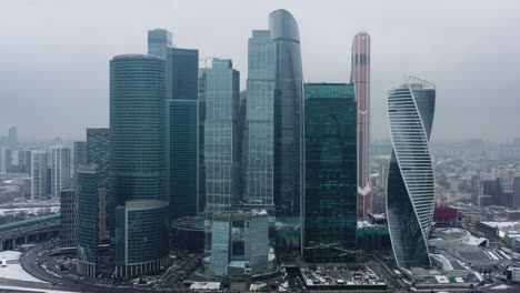 aerial drone shot of moscow city skyscrapers at cloudy winter day