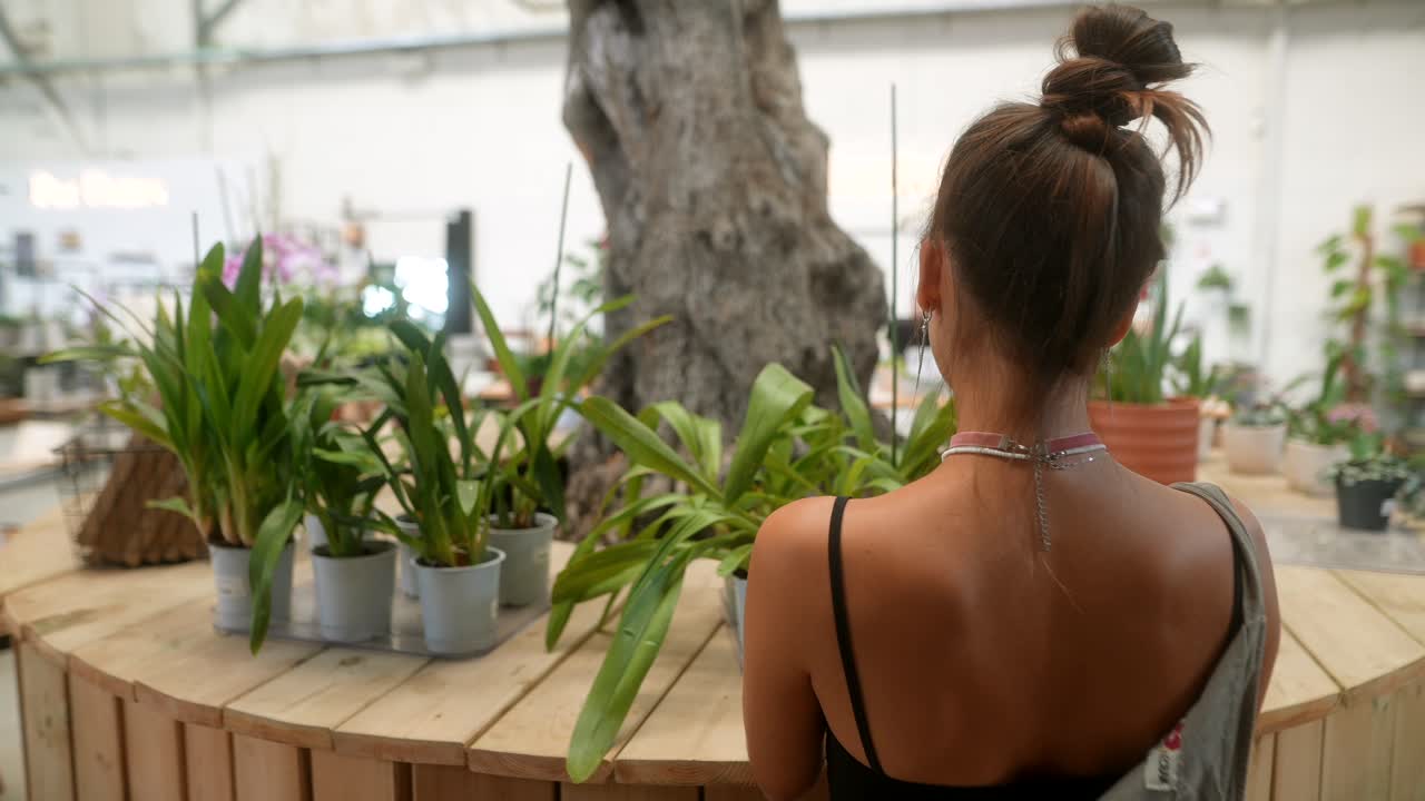 Woman looking at plants