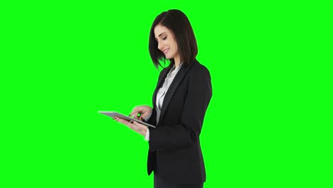 business woman standing and using a tablet