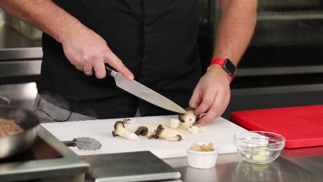 chef chopping mushrooms