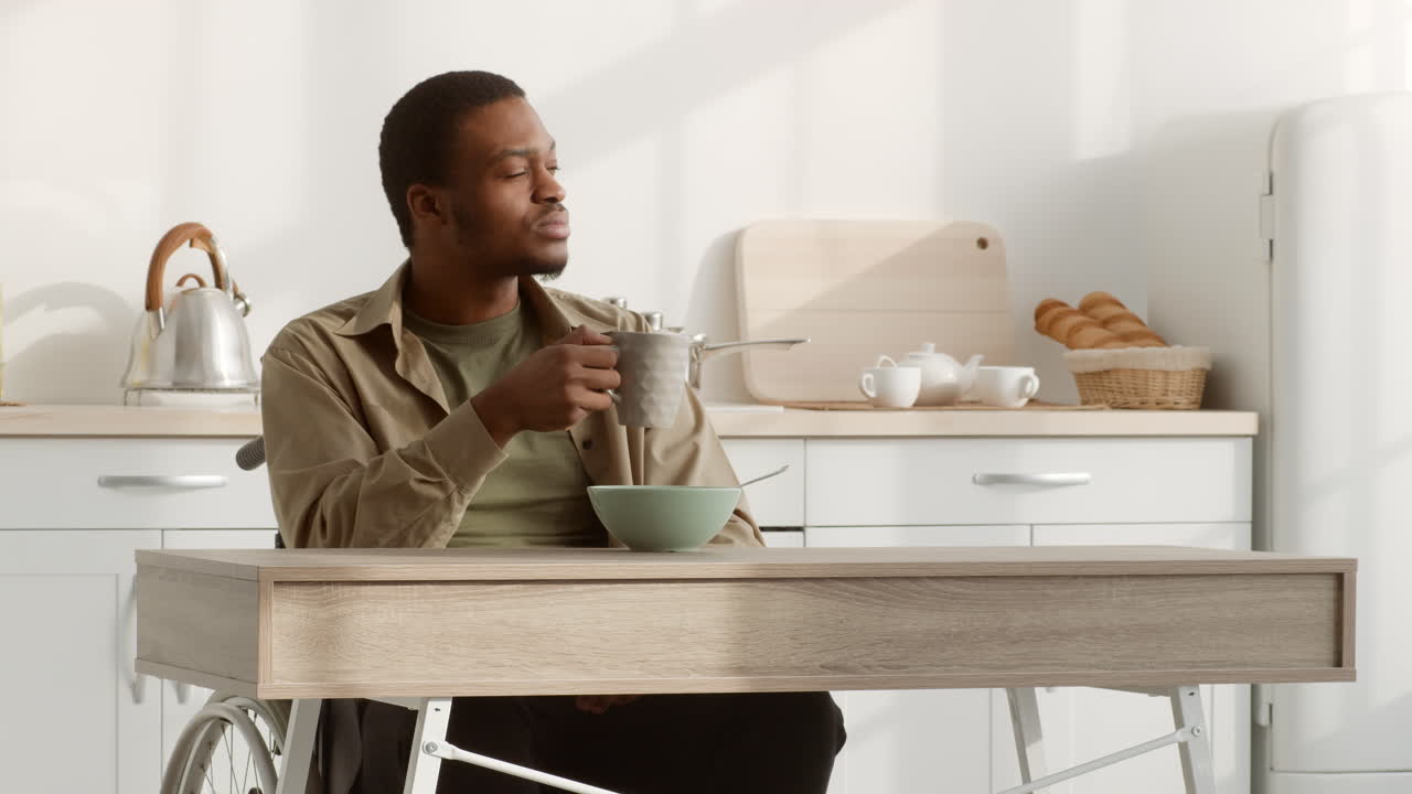 Man in Wheelchair Having Breakfast