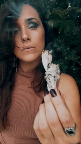 woman smudging with sage