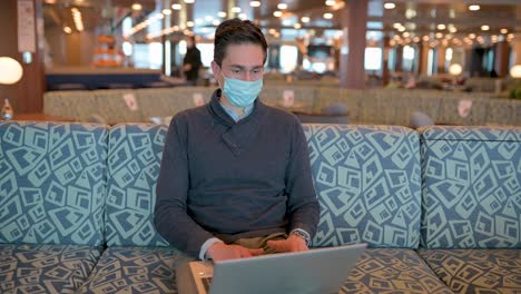 busy man browsing laptop on cruise ship