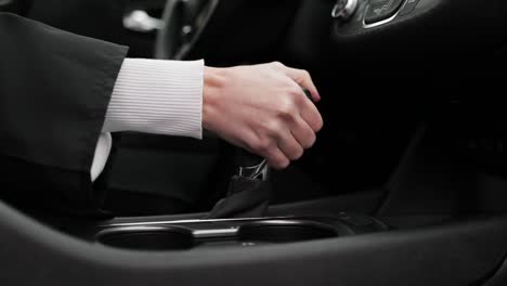 Shifting-Gears-In-Brand-New-Car-Black-Interior-Close-Up