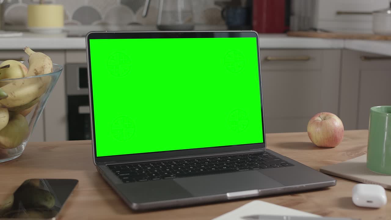 Laptop on Wooden Table in Kitchen Interior