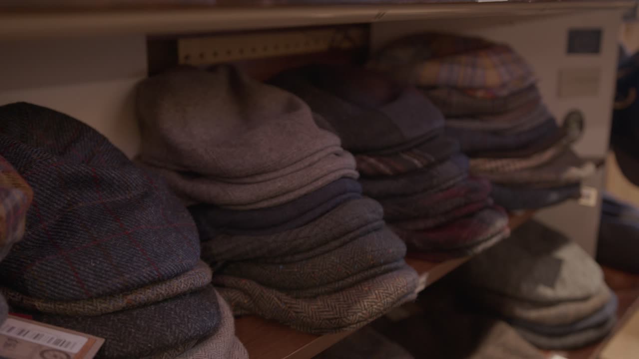 Wide Dolly In of Flat Caps on a Shelf