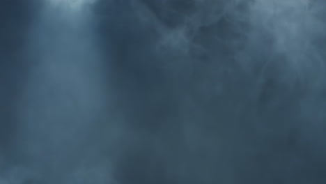 the cinematic atmosphere of smoke being hit with white strobing light