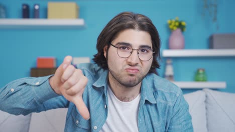 Young-man-looking-at-camera-in-a-negative-and-negative-state.