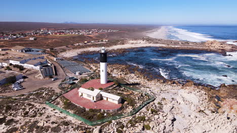 Aerial-orbit-around-Doringbaai-Lighthouse-on-west-coast,-South-Africa