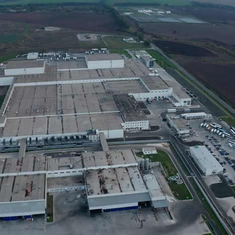 modern plant on field. large industrial zone surrounded by nature. harmful manufacturing in the countryside. aerial view.