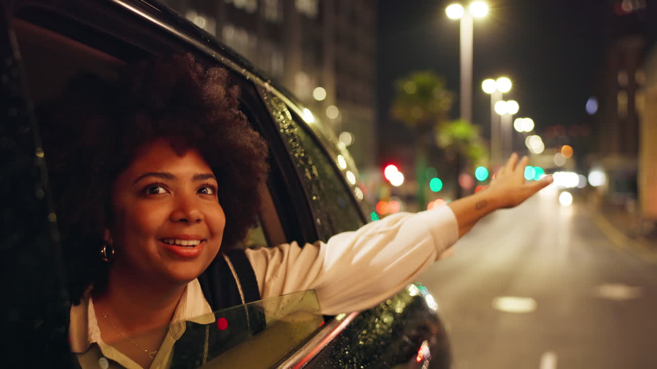 Woman Enjoying a Car Ride at Night